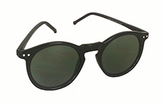 Zwarte ronde modieuze zonnebrillen in uniseks ontwerp.
